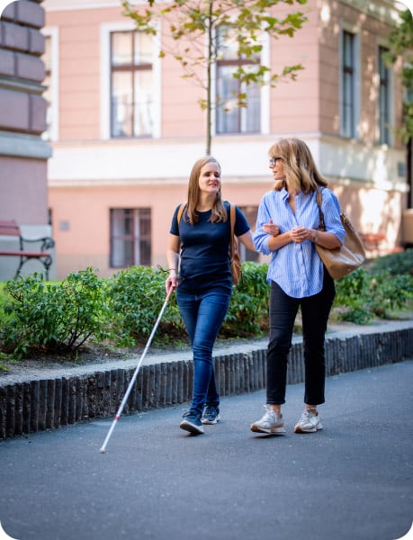 blind woman walking with women